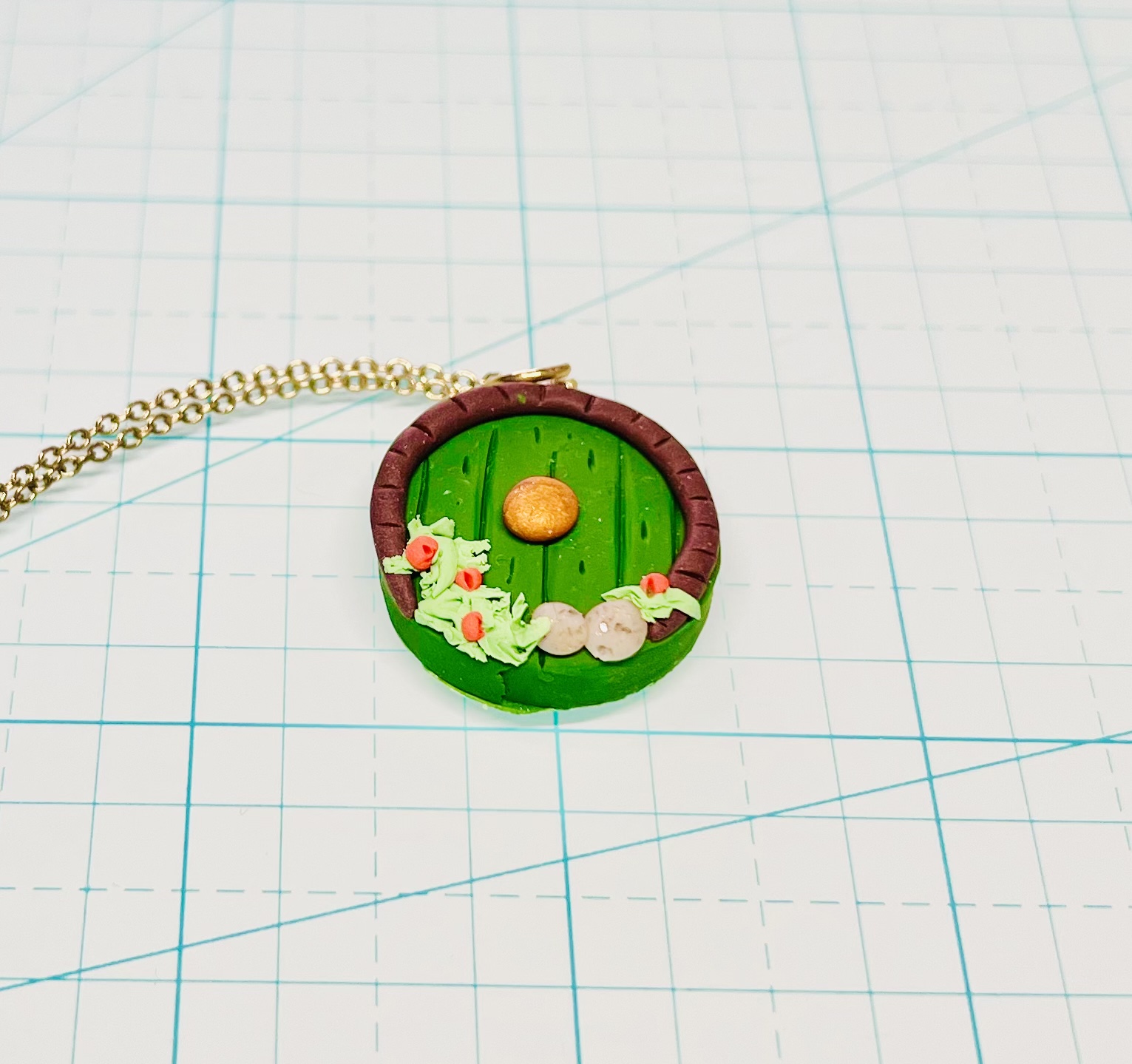 custom hobbit door necklace tolkien gift idea on grid background