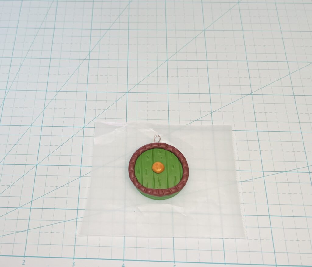 eye pin placed in top of polymer clay hobbit gift idea