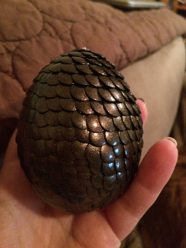 dragon egg made from push pins held in hand