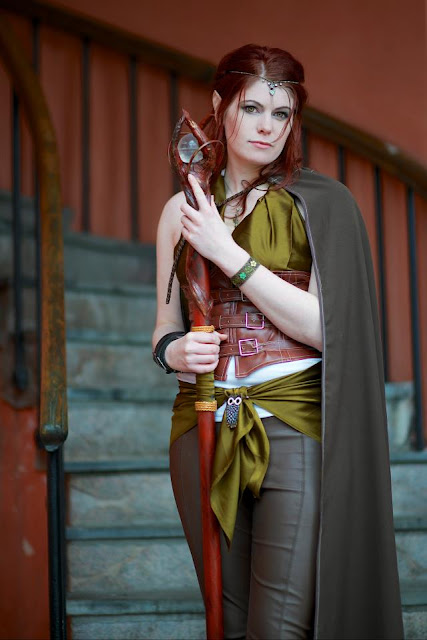 lady wearing elf costume holding elvish staff