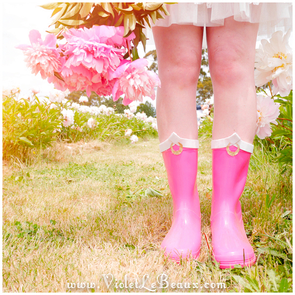 diy sailor moon pink boots worn on feet with flowers in field