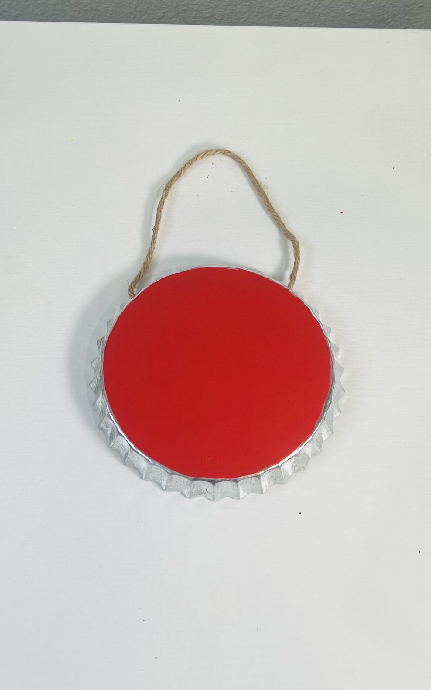 metal bottle cap painted red