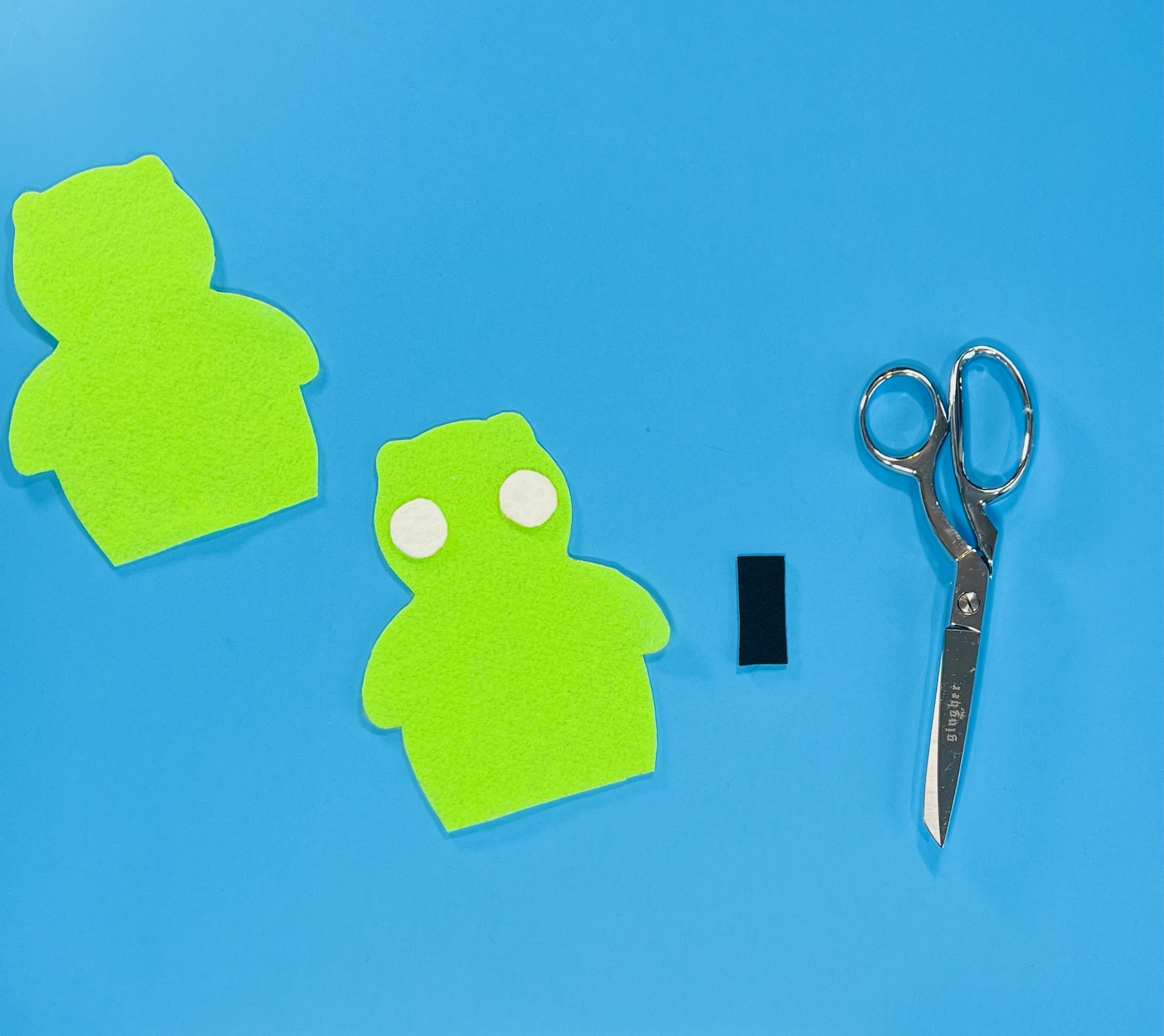 homemade kuchi kopi project with felt pieces and scissors