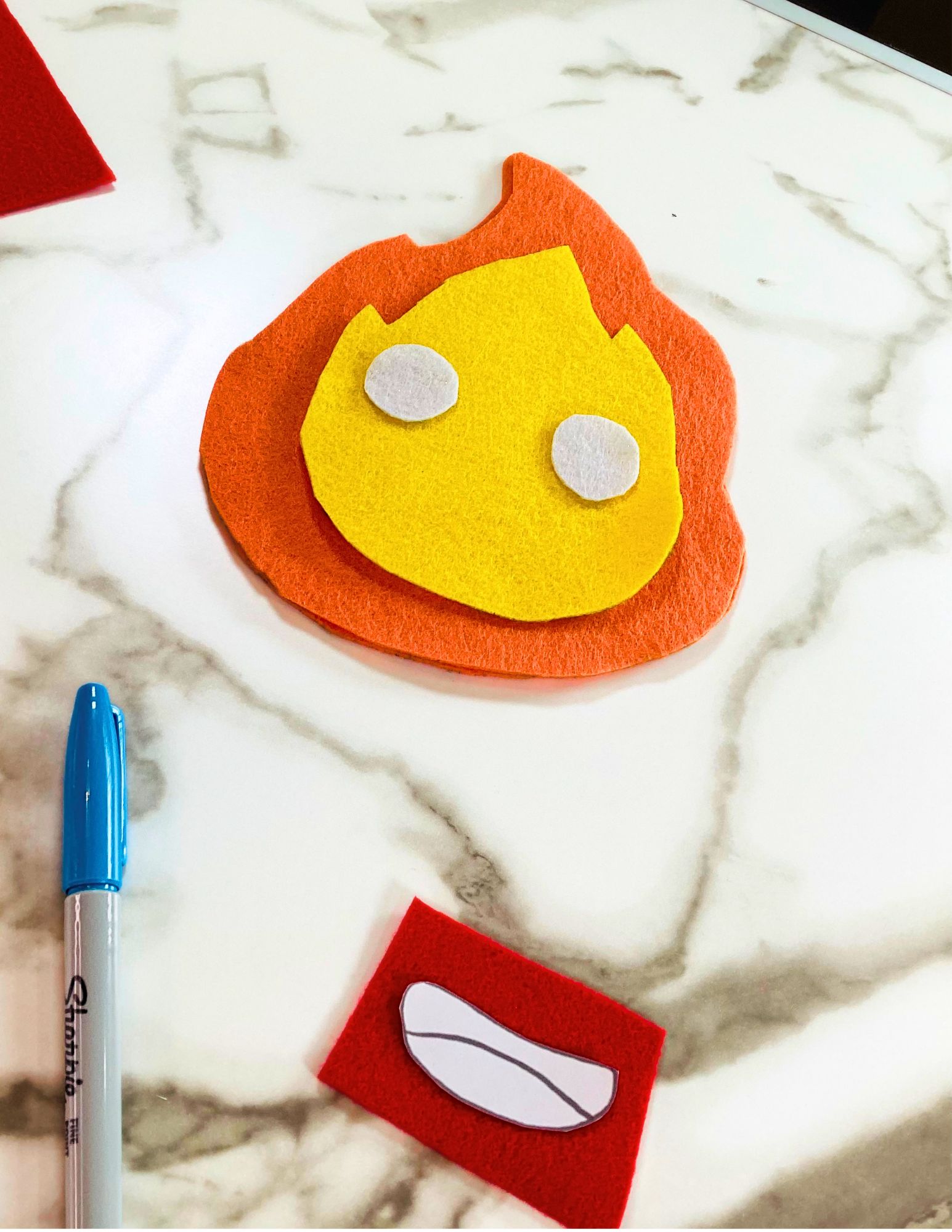 eyes and mouth being cut out for DIY Howl's Moving castle plushie