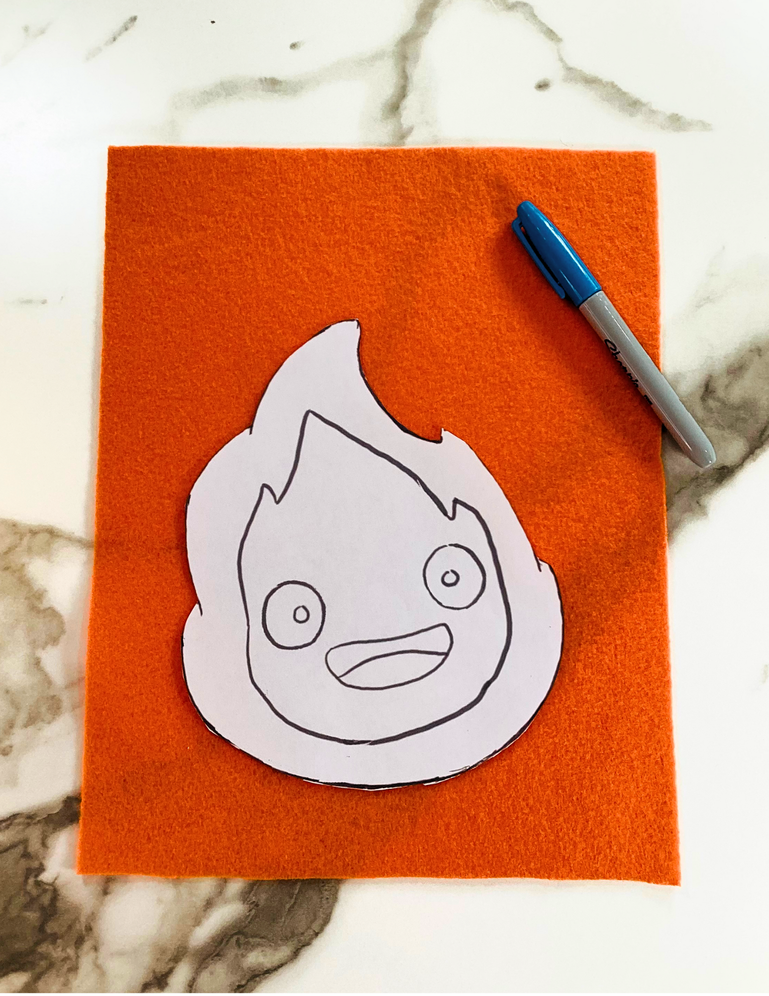 begin by cutting out first layer of DIY calcifer template to trace