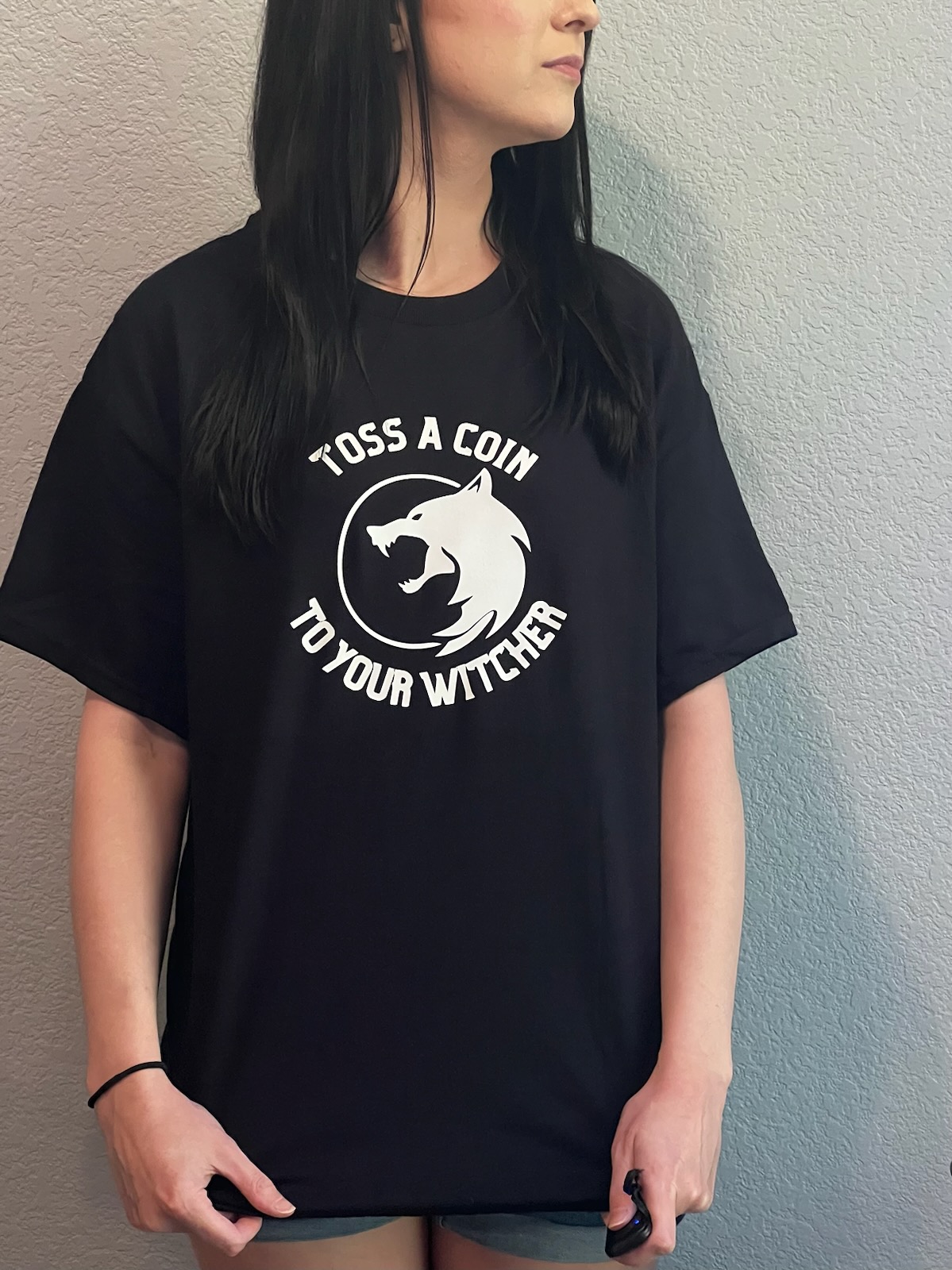 girl modeling free Witcher SVG cut file on black shirt